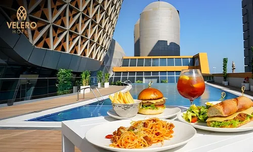 Poolside Meal & Relaxation at Velero Hotel!