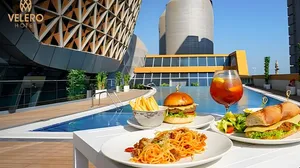 Poolside Meal & Relaxation at Velero Hotel!